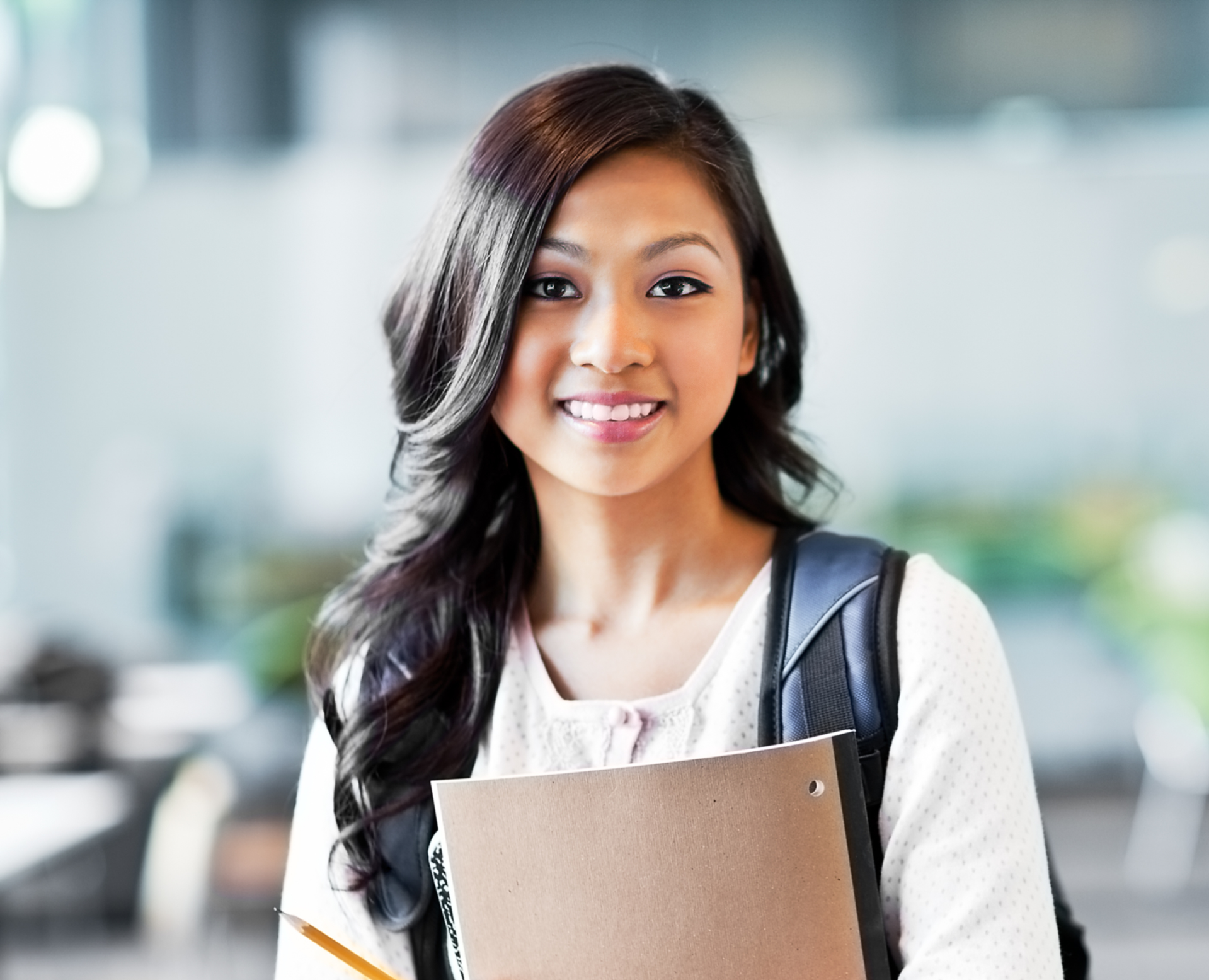 Student holding law school entrance test notes with a backpack